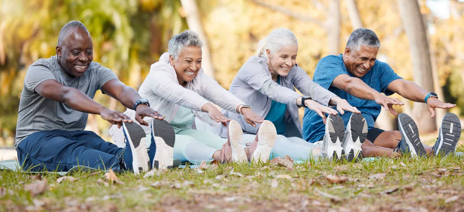 seniors in the park stretching for fitness